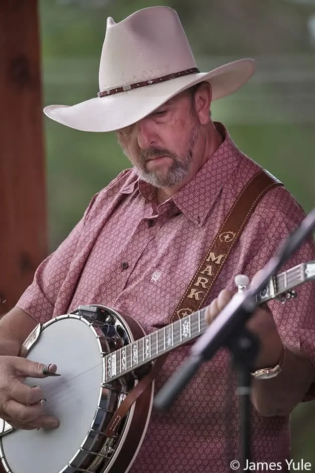 Mark Krider playing banjo with his MARK guitar strap