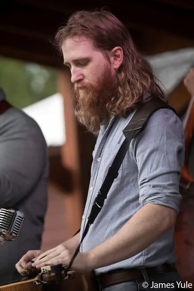 Adam Bachman playing resonator guitar